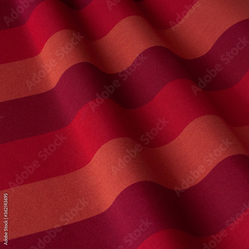 The pattern on the fabric is a red strip. Fabric with natural texture  Cloth backdrop.
