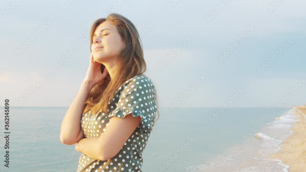 beautiful woman standing on sand on beach, female happy relax on seashore near sea when sunrise at morning. Lifestyle women travel concept beautiful woman standing on sand on beach, female happy relax on seashore near sea when sunrise at morning. Lifestyle women travel concept