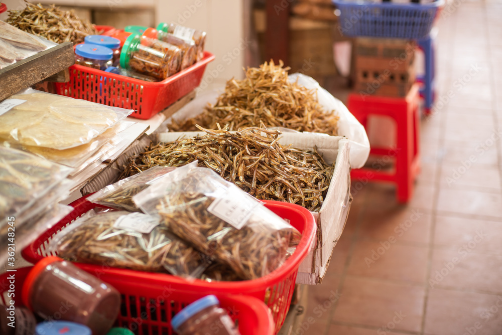 fruits, flowers and fish for sale at a market