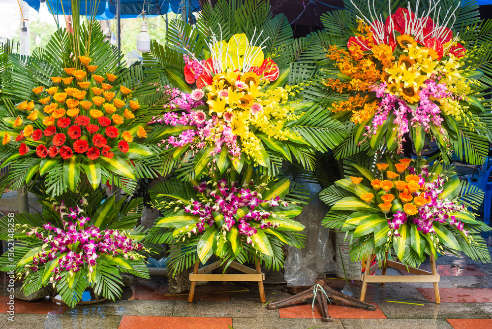 fruits, flowers and fish for sale at a market