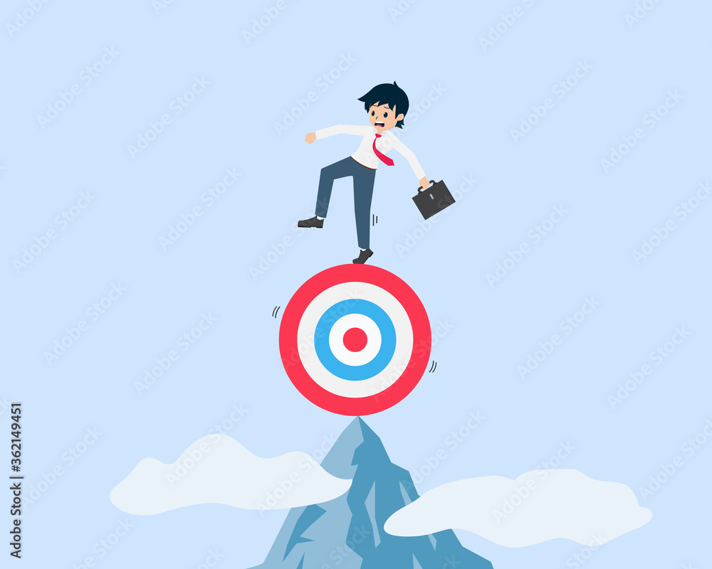 Salary Man Standing on a target at the summit of a high mountain at high risk Salary Man Standing on a target at the summit of a high mountain at high risk