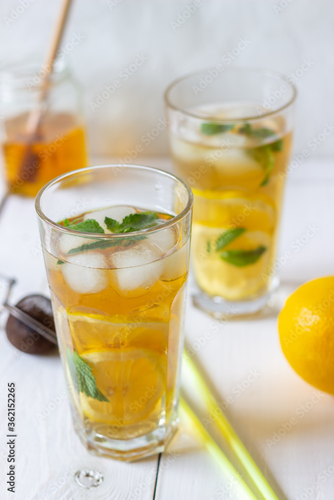 Cold tea with lemon and mint. A summer drink. Healthy eating. Vegetarian food. Diet.