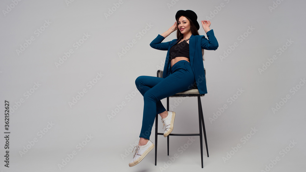 stylish business woman in a dark blue pantsuit. stylish business woman in a dark blue pantsuit.