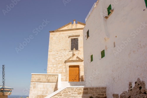 Old town of Ostuni during a sunny day  the white village. It is a turistic destination in Puglia   apulia  in the summer. The city is in white stone bricks and is very old   medieval time .