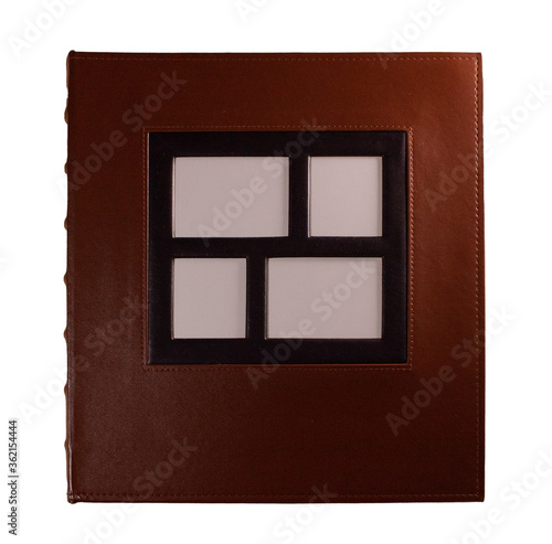 Leather photo album with empty photo frames inserted into the cover on a white background. Is isolated.