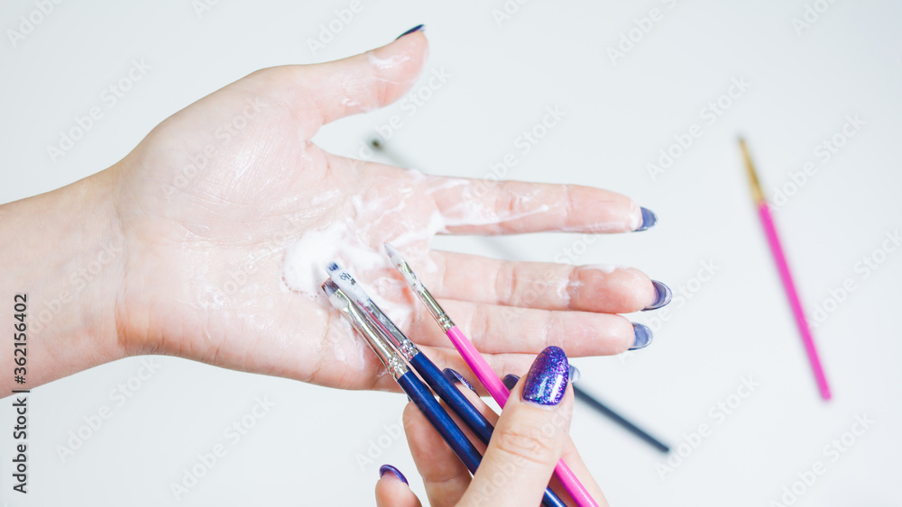 Hygienic care of makeup artist tools, women's hands wash the brush from cosmetics, soap and cleaning products, Hygienic care of makeup artist tools, women's hands wash the brush from cosmetics, soap and cleaning products,