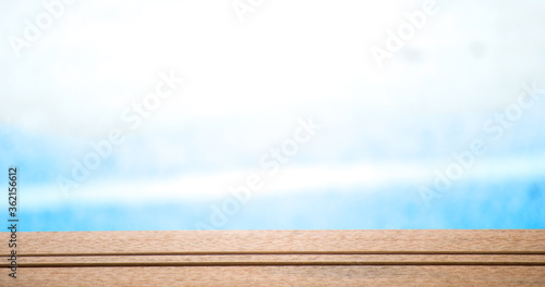 wooden table on blue background