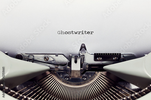 The word ghost writer typed on the paper with a vintage typewriter photo