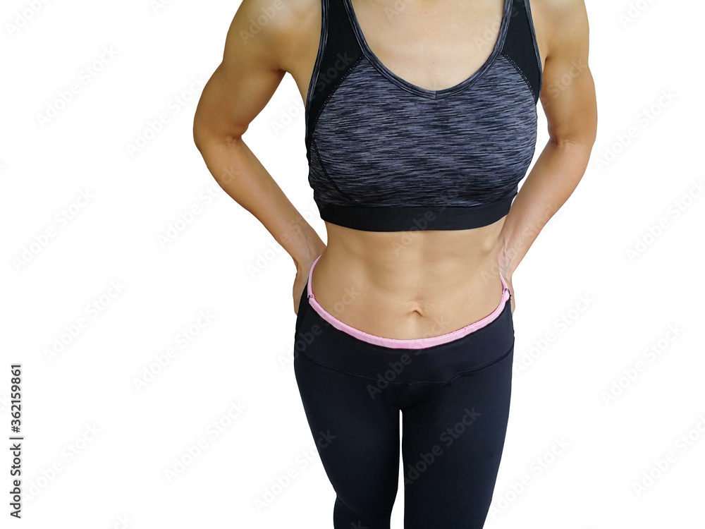 40 year old housewife with exercise and health care. A girl in a sports bra and exercise pants. A young woman exercising shows a six pack and body muscles at Fit Firm. 40 year old housewife with exercise and health care. A girl in a sports bra and exercise pants. A young woman exercising shows a six pack and body muscles at Fit Firm.