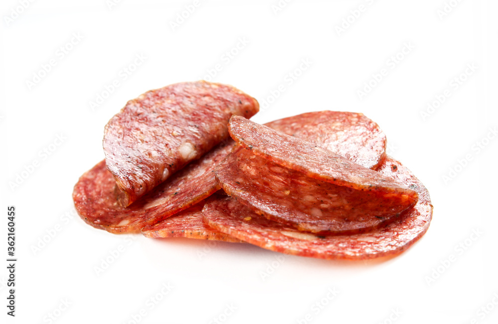 Salami sausage slices isolated on white background. Tasty smoked meat close-up