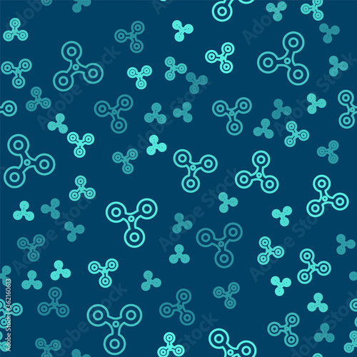 Green line Fidget spinner icon isolated seamless pattern on blue background. Stress relieving toy. Trendy hand spinner. Vector.