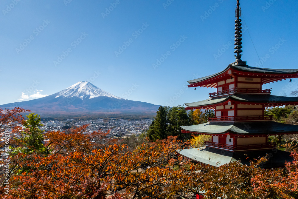 Famous autumn view of Mount Fuji and red Chureito Pagoda on the right with colorful maple leaves, Japan