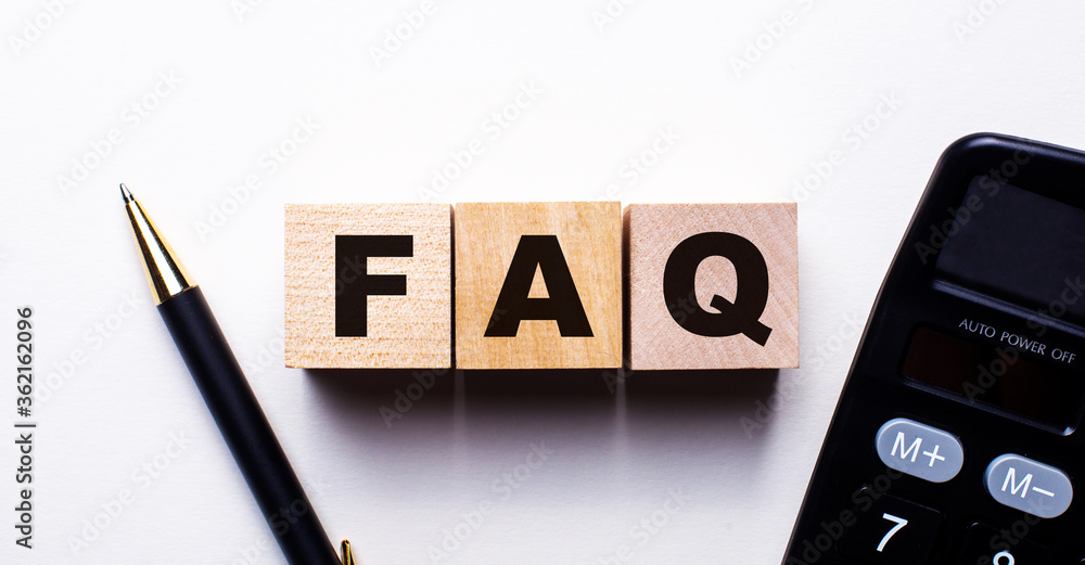Frequently asked questions FAQ on wooden blocks written between a pen and a calculator Frequently asked questions FAQ on wooden blocks written between a pen and a calculator