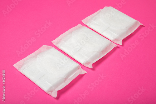 Women's pads on a pink background.Women Health. Intimate hygiene. View from above