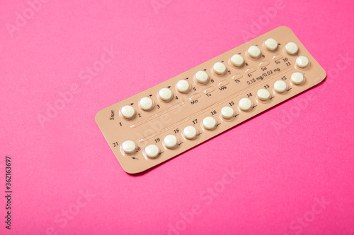 Female oral contraceptives on a pink background