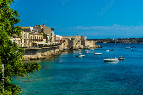 A view across the bay towards Castello Maniace on Ortygia island in Syracuse, Sicily in summer