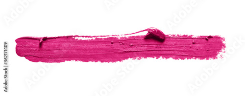 Pink lipstick stroke smudge swatch isolated on white background. Color makeup brush stroke close up. Creamy cosmetic product texture