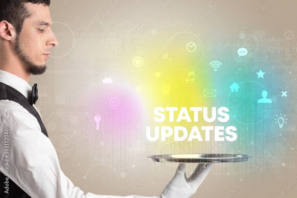 Waiter serving social networking with STATUS UPDATES inscription, new media concept Waiter serving social networking with STATUS UPDATES inscription, new media concept