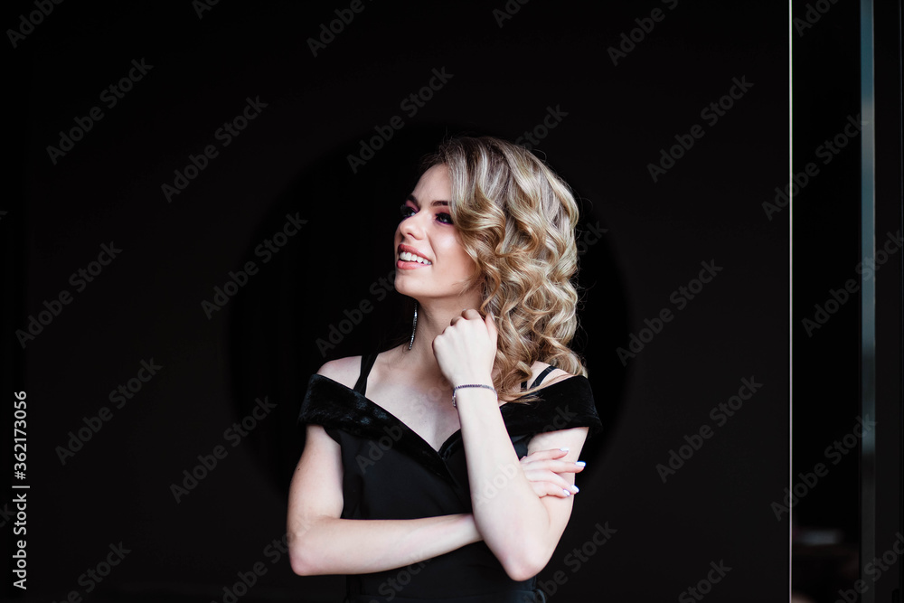 Beautiful blonde, young girl. Portrait of a young girl in a restaurant. Young girl in a restaurant on a black background. Portrait of a girl in a black dress. Young girl. Beautiful blonde, young girl. Portrait of a young girl in a restaurant. Young girl in a restaurant on a black background. Portrait of a girl in a black dress. Young girl.