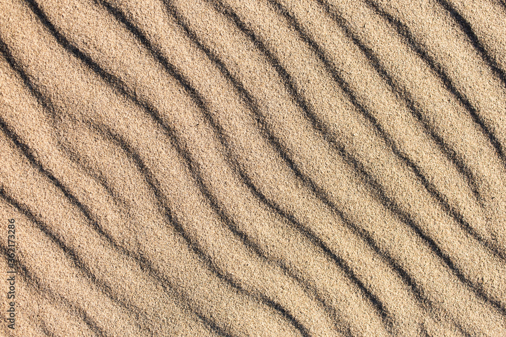 Natural sand pattern, interesting abstract texture. Waves on a sand. Natural sand pattern, interesting abstract texture. Waves on a sand.