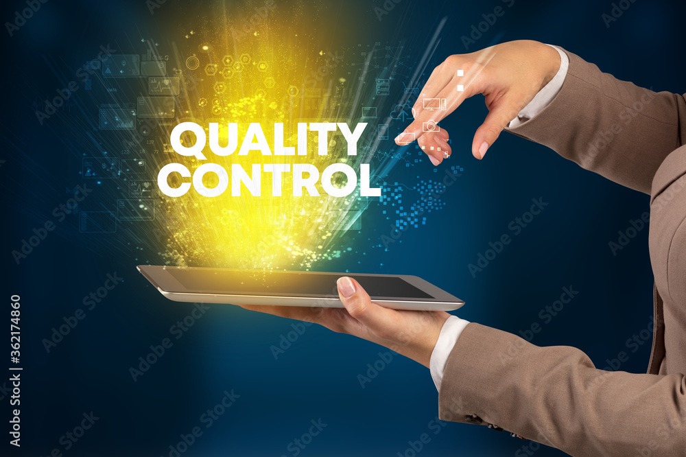 Close-up of a touchscreen with QUALITY CONTROL inscription, innovative technology concept Close-up of a touchscreen with QUALITY CONTROL inscription, innovative technology concept