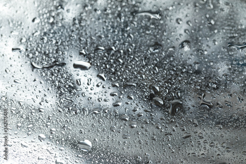 background rain water drops on white glass. Gradient metallic background