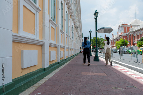 Wallpaper Mural The yellow ancient building on a road with a solar background, a vacant road beside the Ministry of Defense window, one of the important places in Thailand.Perspective of Thailand min Torontodigital.ca