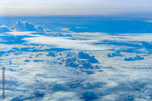 beautiful cloud on blue sky see from airplane window. © patanasak