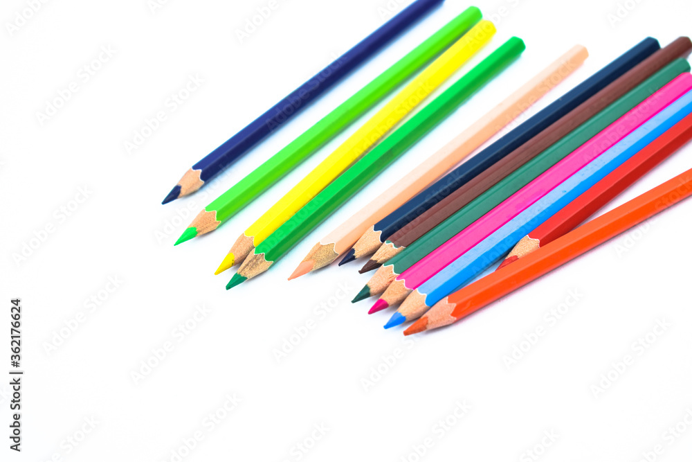 Lot of different colored wood pencil crayon placed in a white background Lot of different colored wood pencil crayon placed in a white background