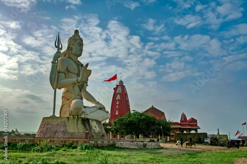 Giant sculpture of Shiva Nageshwar at the famous Nageshwar temple close to Dwarka. Gujarat. India. photo