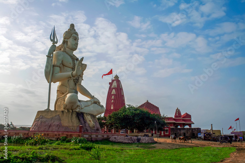 Giant sculpture of Shiva Nageshwar at the famous Nageshwar temple close to Dwarka. Gujarat. India.