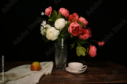 Still life in low key with black background.
