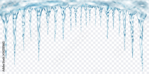 Group of translucent light blue realistic icicles of different lengths connected at the top. For use on light background. Transparency only in vector format