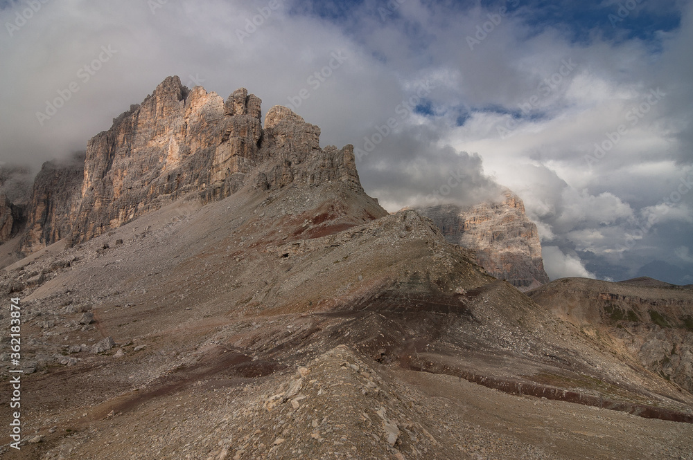 On the final stretch to Refugio Lagazuoi at the end of the long and relentless uphill climb on stage 2 of Alta Via 1 trek from Refugio Fanes to Refugio Lagazuoi, Dolomites, South Tirol, Italy. On the final stretch to Refugio Lagazuoi at the end of the long and relentless uphill climb on stage 2 of Alta Via 1 trek from Refugio Fanes to Refugio Lagazuoi, Dolomites, South Tirol, Italy.