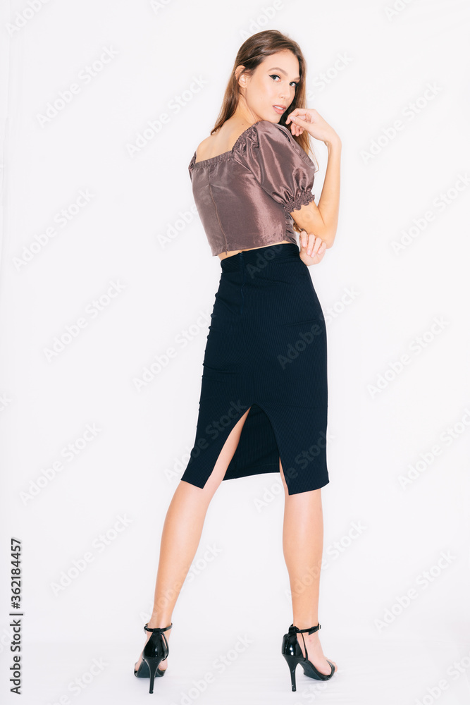 young woman in a dress, isolated on white.