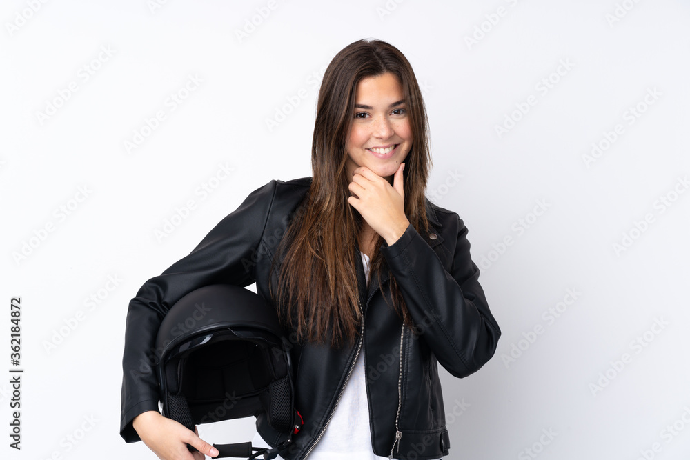Young woman with a motorcycle helmet over isolated white background laughing Young woman with a motorcycle helmet over isolated white background laughing