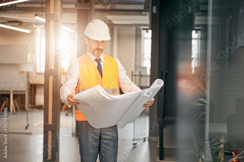 Wallpaper Mural Portrait of a successful builder in a white helmet and business suit Torontodigital.ca