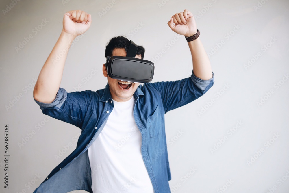 A man wearing virtual reality glasses. A man wearing virtual reality glasses.