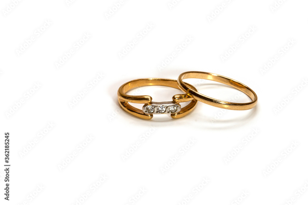 two golden wedding rings on white background, isolated