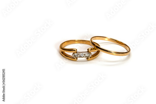 two golden wedding rings on white background, isolated