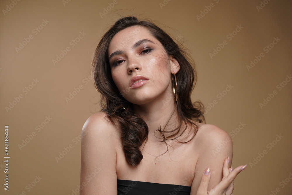 Portrait of a beautiful woman with a long hair. Young brunette model with beautiful hair - isolated on white background. Young girl with hair flying in the wind. Portrait of a beautiful woman with a long hair. Young brunette model with beautiful hair - isolated on white background. Young girl with hair flying in the wind.
