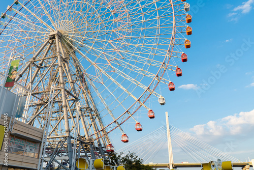 Yellow cabin Tempozan Ferris Wheel with blue sky in Osaka, Japan