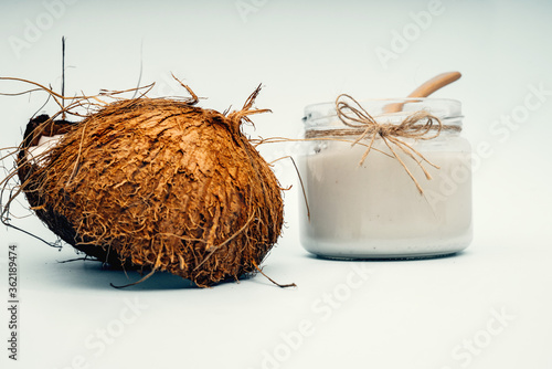 Parts of coconut on a colored background. Close up. Fresh ripe coconut broken into pieces. Coconut oil.