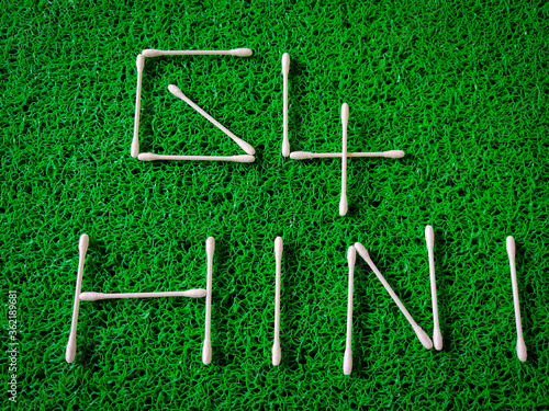 Inscription text of new virus called G4 H1N1 made of cotton ear sticks. Isolated on green background