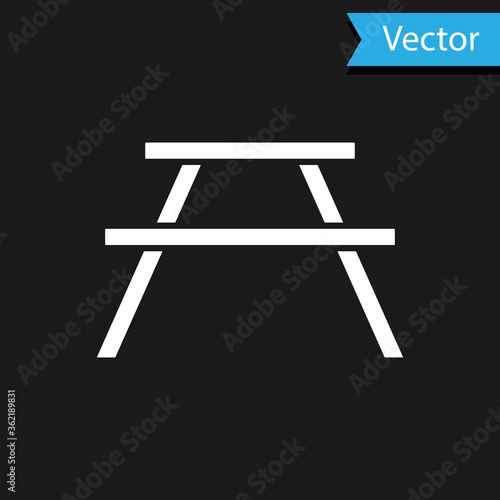 White Picnic table with benches on either side of the table icon isolated on black background.  Vector Illustration