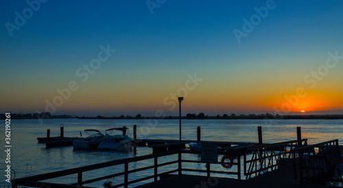 Sunrise seen from the boat dock in the delta © Larry D Crain