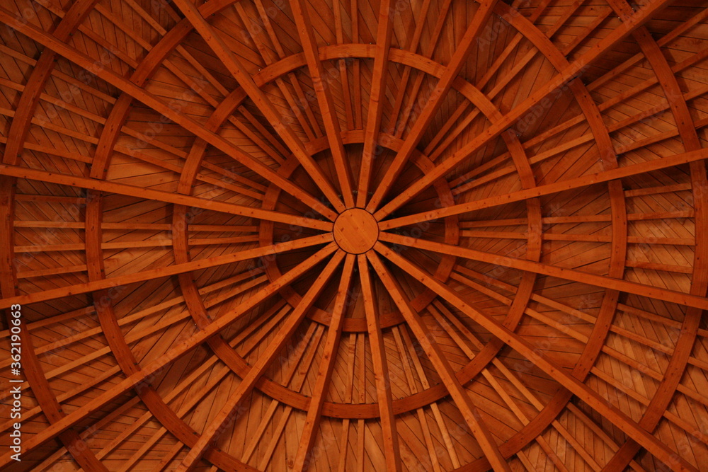 inside view of wood roof construction in warm red color