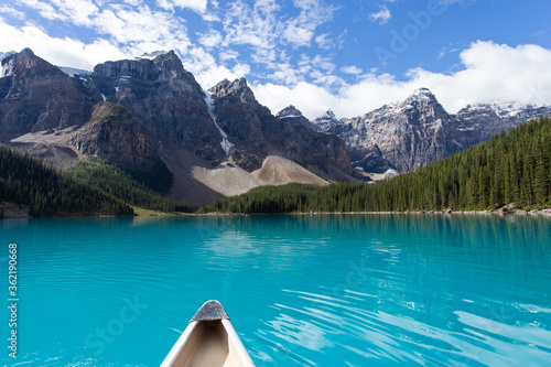 nose of a canoe on a very turquoise lake