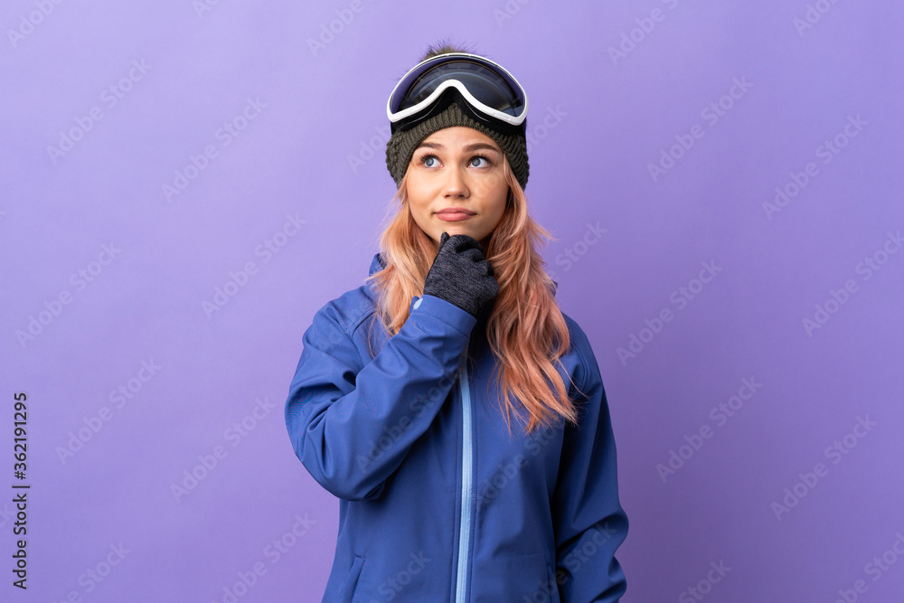 Skier teenager girl with snowboarding glasses over isolated purple background having doubts and thinking Skier teenager girl with snowboarding glasses over isolated purple background having doubts and thinking
