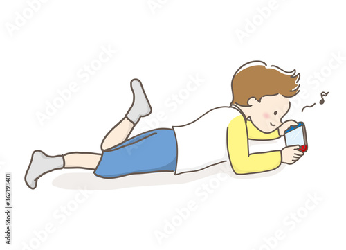 寝ながらゲームする男の子